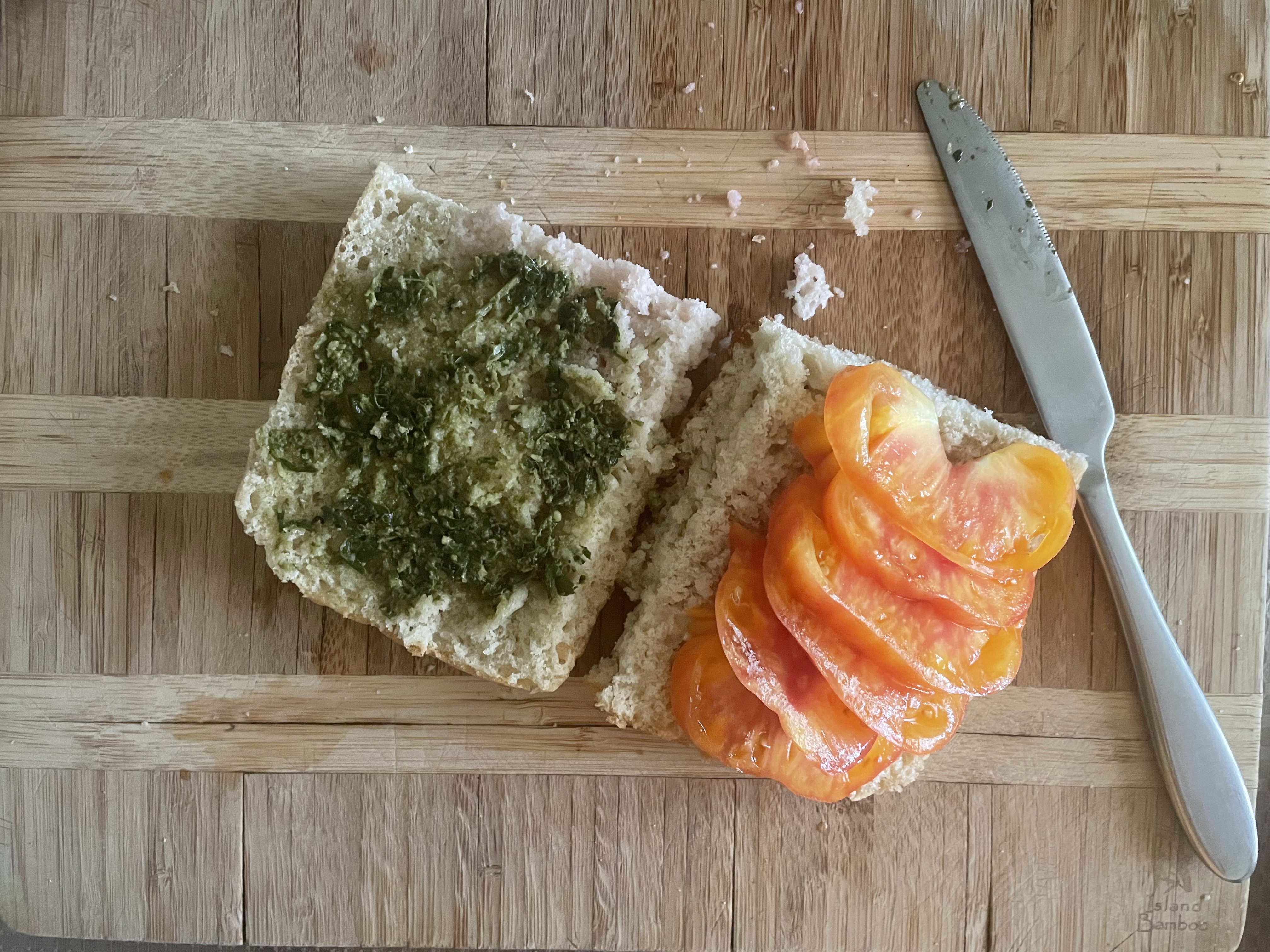 bottom half of bread with heiloom tomato